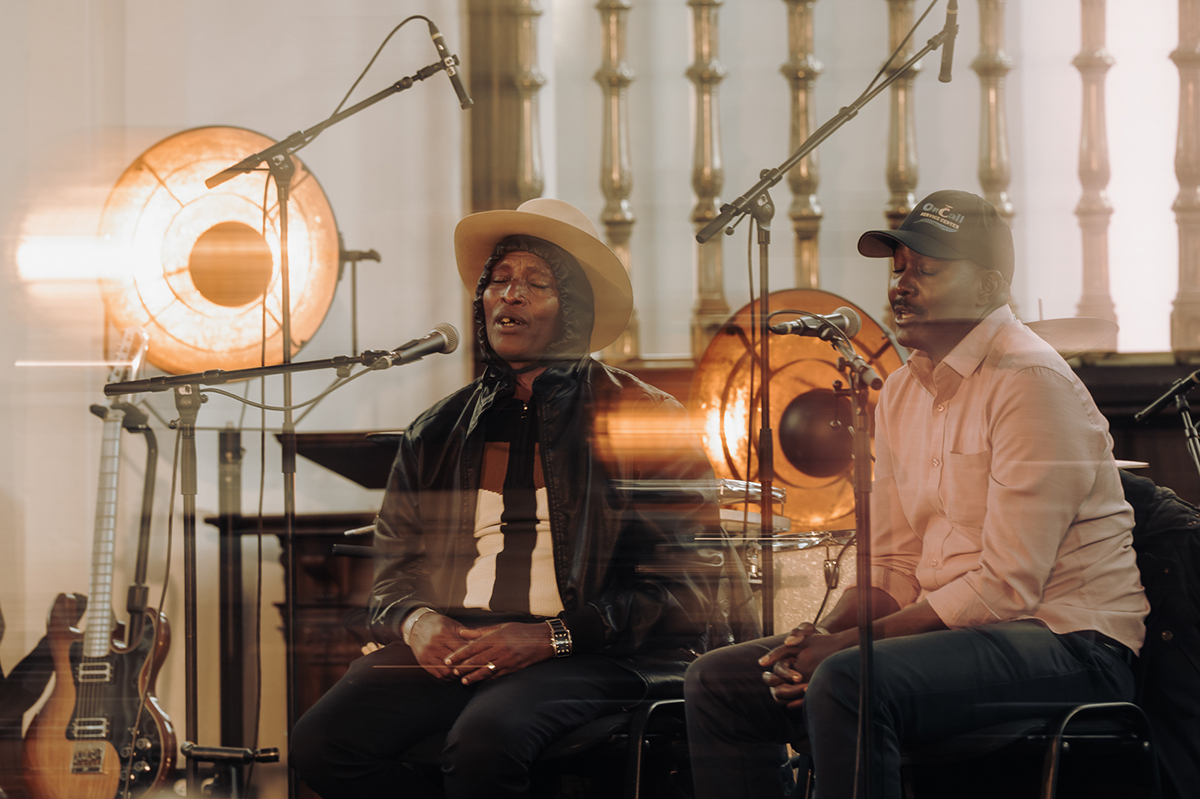 The two musicians of Katokye performing at Le Guess Who?, both singing with concentration with their eyes closed.